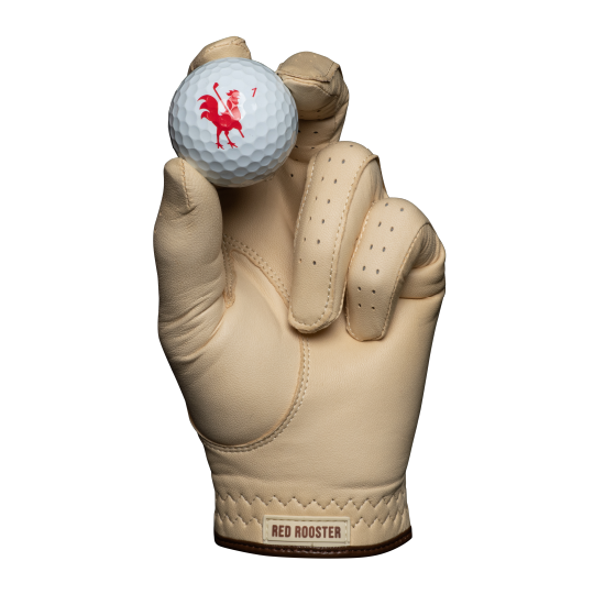 The Tawny golf glove holding golf ball