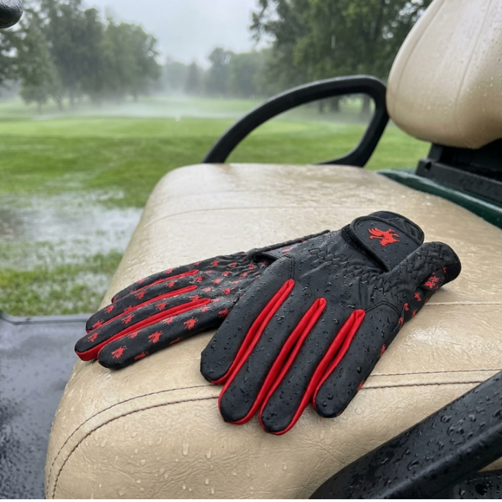 Golfer wearing Rain Rooster wet-weather golf gloves on the course