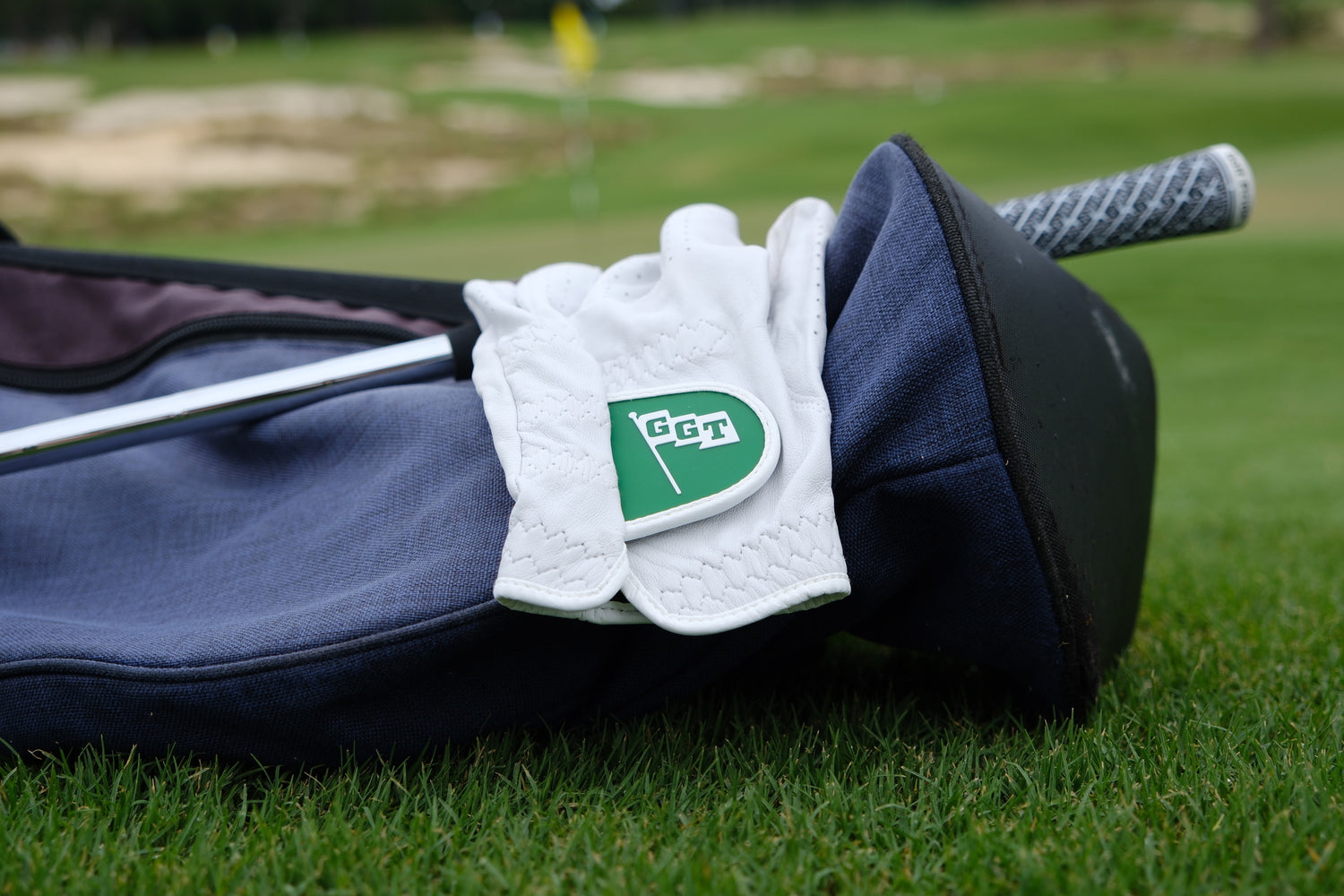 The Shrink golf glove on a bag