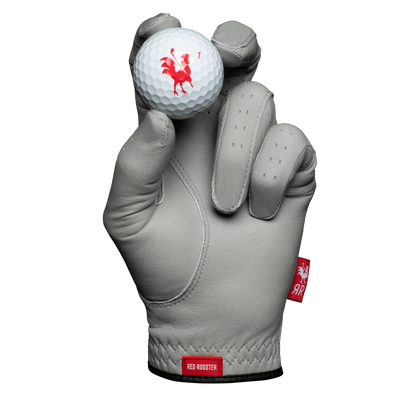 The Brahma golf glove holding golf ball