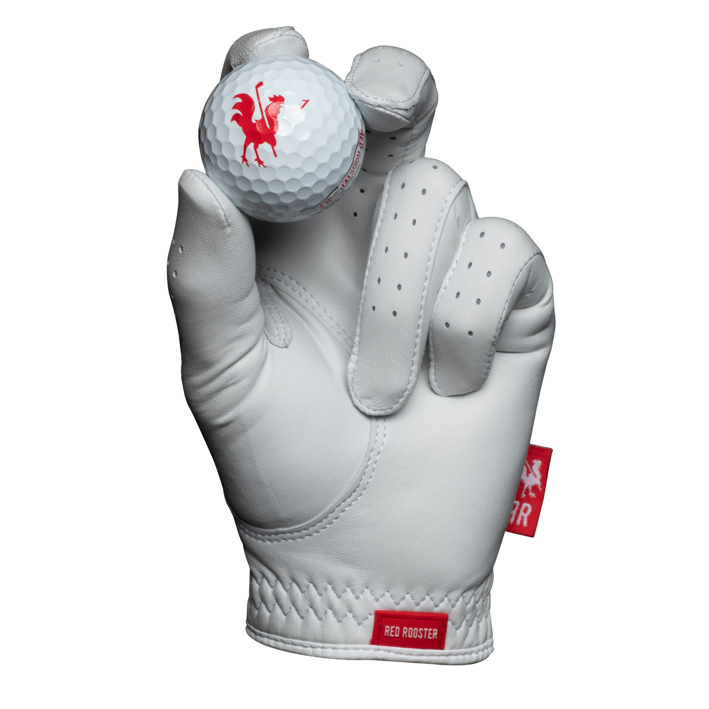 The Feather golf glove holding golf ball