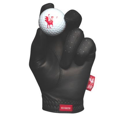 The Saddle golf glove holding golf ball