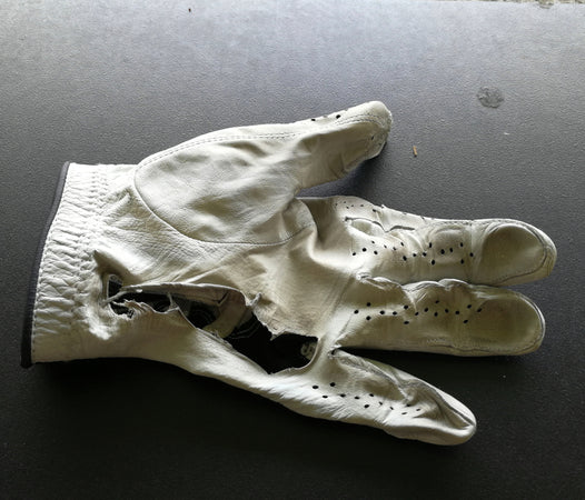 Golf Glove with a hole in it