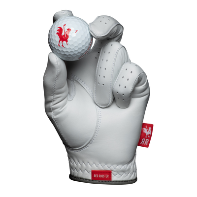 The Silkie golf glove holding golf ball