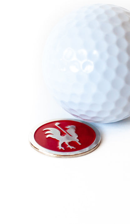 close up view of The Standard ball marker and golf ball