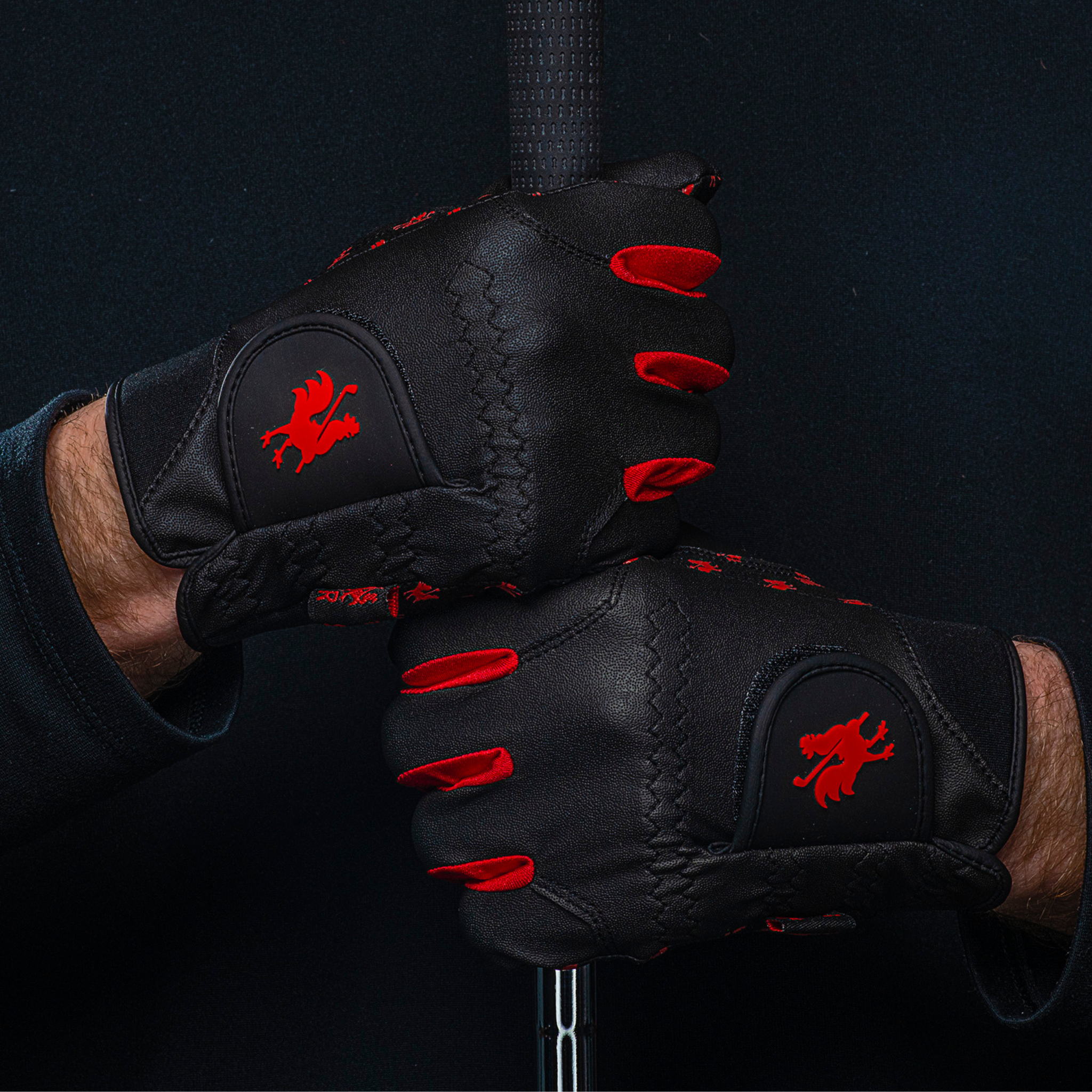 Rain Rooster golf gloves holding golf club