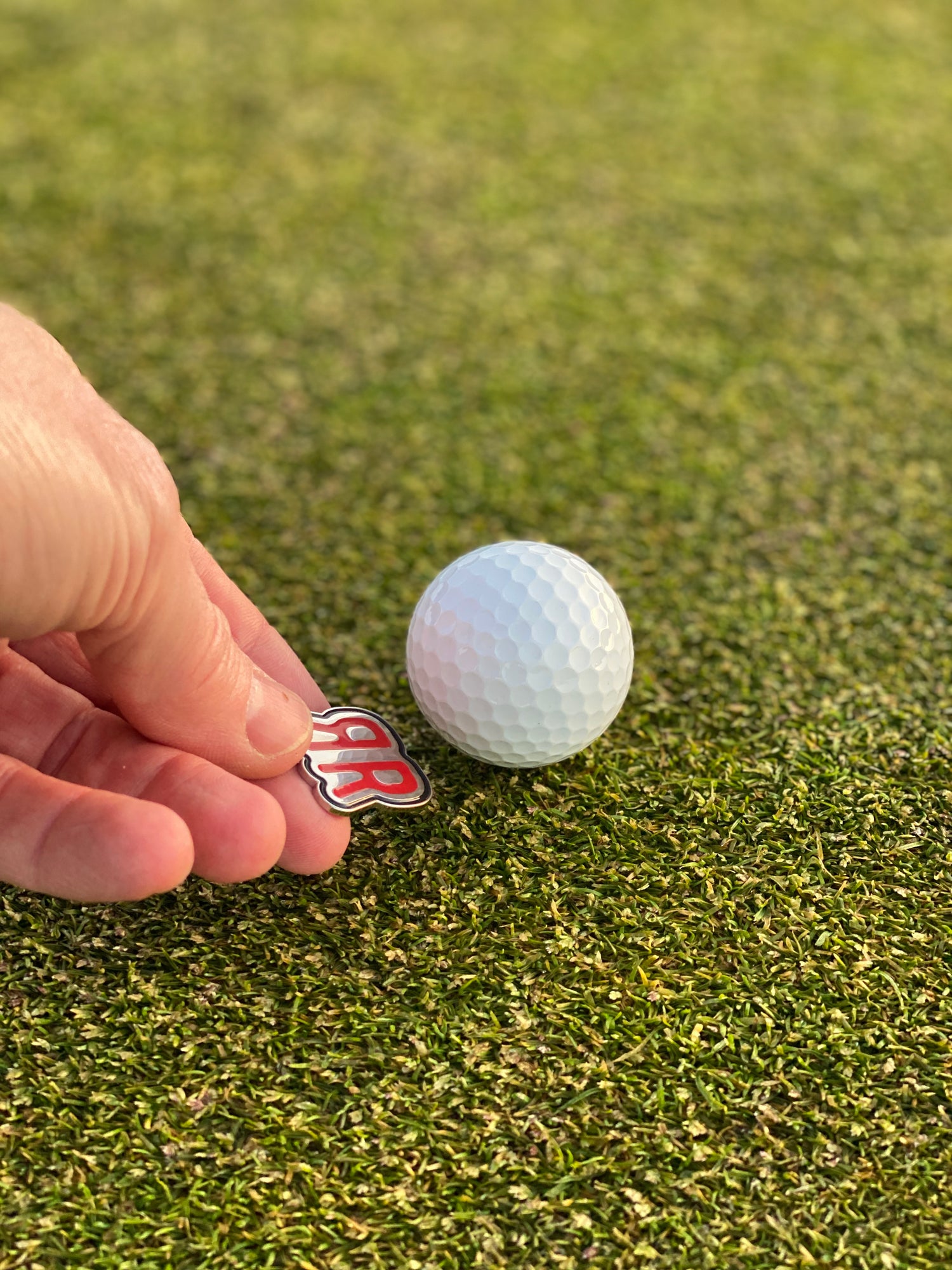 The Mirror ball marker placed with golf ball